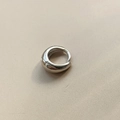 Minimalist silver hoop earrings with a polished metallic finish on beige fabric - 10mm Pair / Silver