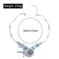 Dettaglio della collana girasole con perle turchesi e incisioni con motivi vichinghi - YN516/Ciondolo Girasole