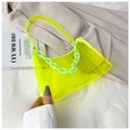 Detail of neon yellow transparent PVC shoulder bag with green acrylic chain link handle - Green