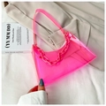 Detail view of pink transparent jelly bag with thick chain on a white blazer - Pink