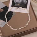 Elegant natural baroque pearl necklace with gold clasp laid on vintage display tray - 972#HJ Titanium Steel Natural Pearl Necklace