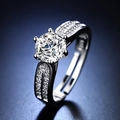 Elegant six-prong silver moissanite engagement ring with split shank on blue background - Y070【1 Carat】