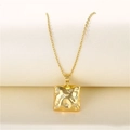 Detail of gold square pendant with lava texture and zircon stars on a delicate chain - Gold