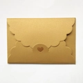 Golden pearlescent envelope with scalloped edges and a heart-shaped laser-cut closure - Pearlescent Rice Gold