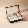 12-Slot Uhrenbox aus schwarzem Kunstleder mit Glassichtfenster und weißen Ziernähten - 12 Slots - Beige Interieur