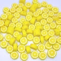 Macro shot of 10mm yellow lemon polymer clay beads for jewelry making and DIY crafts - Lemon