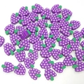 Macro shot of 10mm purple polymer clay grape beads for DIY jewelry and crafts making - Grapes