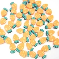 Macro view of 10mm orange polymer clay carrot beads for DIY jewelry making and crafts - Carrot