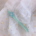 Mint green cartoon gel pen with blue flower topper on white sequin mesh background - 0.5mm / Blue Flower (Colorful Barrel)