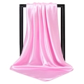 Pink satin square scarf with a silky finish hanging on a black minimalist frame - Pink