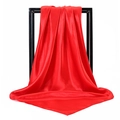 Detail of red satin scarf with high glossy texture displayed on a minimalist black frame stand - Red