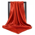 Detailed view of dark red satin silk square scarf draped to show soft texture and high shine - Rust Red