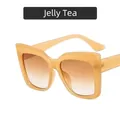 Oversized γυαλιά ηλίου cat-eye με ημιδιαφανή σκελετό jelly tea και φακούς gradient - Τσάι Ζελέ