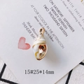 Macro detail of conch-shaped shell pendant with gold-plated edge on decorative card - Style 15# Textured Pendant (25*14mm)