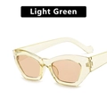 Occhiali da sole retrò cat-eye con montatura verde chiaro trasparente e lenti arancioni - verde chiaro
