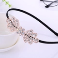 Elegant black headband with golden bow and sparkling rhinestones for women - Large Rhinestone Bowtie