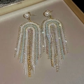 Macro shot of long fringe earrings with colorful rhinestones and pearls on velvet tray - White U-Shaped Tassel (Silver Earring Post)