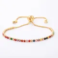 Adjustable gold bracelet with colorful row of cubic zirconia stones and slide clasp - Gold