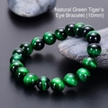 Macro shot of 10mm natural green tiger eye stone bracelet beads with silky texture - Green Tiger Eye Bracelet (10mm)