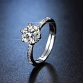 Macro shot of six-prong moissanite ring with brilliant round cut and side stones - Y036 Classic Six-Prong Pave