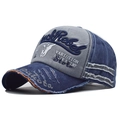 Detailed close-up of Rock Rebel embroidery and vintage distressed fabric on baseball cap - Adjustable / Navy Blue (Bull Head Embroidery)