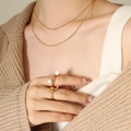 Double-layered gold snake chain necklace with pearl ring set worn over beige sweater - Double Layer Necklace / Gold
