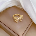 Luxurious gold butterfly zircon ring shown in a premium brown gift box on white silk - Adjustable Open / Bowknot Gold Plated Style (J0158)