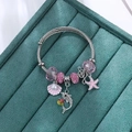 Bohemian ocean charm bracelet with pink crystal beads, dolphin and shell on steel wire - Pink