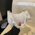 Detail of white quilted crescent bag featuring scrunchie handle and mini coin purse - White
