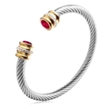 Zilveren gedraaide armband met gouden accenten en rode edelstenen - Januari (Granaat Zirkonia)