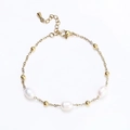 Macro detail of waterproof gold beaded bracelet with three elegant white oval pearls - Three Pearls Accent / Gold
