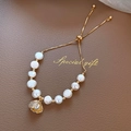 Gold plated cat eye stone bracelet with pearl shell charm and adjustable chain - Natural Pearl Bracelet
