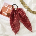 Detail of red polka dot chiffon hair scrunchie with long ribbon and metal buckle - Polka Dot Red