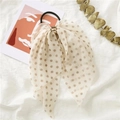 Detail of polka dot bow scrunchie with beige ribbon and elegant gold metal buckle accent - Polka Dot Beige