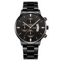 Close-up of black chronograph watch with rose gold indices and date window display - Black Case Black Dial Rose Gold Accents