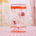 Orange liquid hourglass timer with windmill wheel and romantic Kiss You lettering - Red Lips