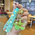 Mint green unicorn star liquid glitter keychain with tiny seashell and starfish - Green Ocean Petals
