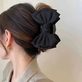 Elegant large black satin ribbon bow hair claw clip for bun hairstyles on model - 16cm Large Bow Claw Clip