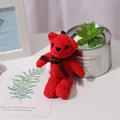 Handmade red crochet teddy bear plush charm with dark brown ribbon bow detail - Red