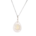 Macro shot of silver tree of life pendant featuring translucent crystal waterdrop detail - White Howlite