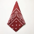 Flat lay of a folded dark red paisley hip-hop bandana on a white background - Burgundy