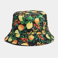 Detailed view of the vibrant lemon and cherry fruit patterns on the black bucket hat fabric - M / Black Yellow Peach