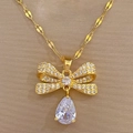 Detail of gold butterfly bow pendant with pear-shaped water drop zircon and micro-pave - Bowknot Teardrop Necklace (D229)
