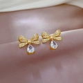 Detail of butterfly and teardrop earrings with pavé zircons on silk background - Bowknot Teardrop Stud Earrings (D230)