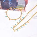 Set di collana e bracciale in acciaio dorato con ciondoli a stella e luna blu - Set Collana e Bracciale Luna