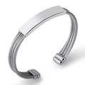 Detailed macro view of silver titanium steel cable bracelet with smooth rectangular plaque - Silver