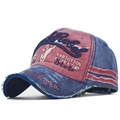 Macro view of vintage washed cotton baseball cap with Rebel 3D embroidery and frayed brim - Adjustable / Wine Red (Bull Head Embroidery)
