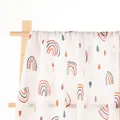 Rainbow pattern muslin swaddle blanket for newborns made of soft cotton hanging on a hanger - Rainbow & Raindrops (S97)