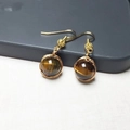Detail of 14K gold filled handmade wire wrapped earrings with round brown tiger eye stone - Tiger Eye Stone Pair