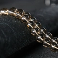 Polished smoky brown crystal round beads on a string for jewelry making - Brown